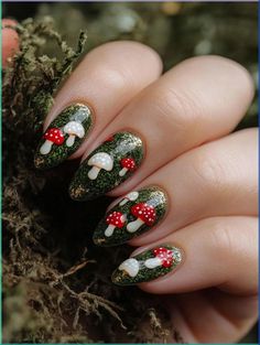 Step into a magical world with Fairy Tale Forest nails. Rich mossy green backgrounds highlight clusters of red and white mushrooms, accented with touches of gold. Perfect for those who love nature-inspired, earthy designs. #FairyTaleNails #MushroomNails #NatureNails Mushroom Forest Nails, Mushroom Fall Nails, Forest Inspired Nails, Shroom Nails, Woodland Nails, Enchanted Forest Nails, Mushroom Nail Designs, Forest Nails, Mushroom Nail Art