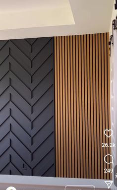 the wall is painted black and brown with wood slats