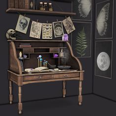 an old desk with books and pictures on the wall next to it in a dark room