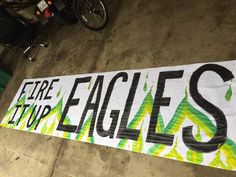 there is a sign that says fire up eagles