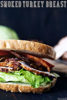 a close up of a sandwich with meat and lettuce