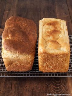 two loafs of bread sitting on top of a cooling rack next to each other