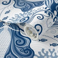 a blue and white wallpaper with an intricate design on it's surface,