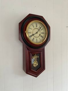 a clock mounted to the side of a wall