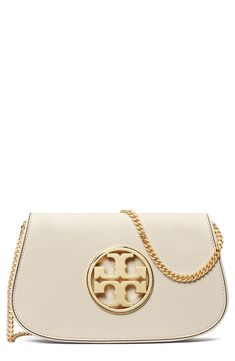 A gleaming logo medallion stands out on the rich leather exterior of a compact clutch fitted with an optional chain strap for hands-free wear. Structured silhouette with flat base for stability Lined Leather Imported Elegant Wallet On Chain With Gold-tone Logo Plaque, Luxury Beige Wallet On Chain, Elegant Evening Wallet On Chain With Logo Plaque, Elegant Wallet On Chain With Logo Plaque, Elegant Evening Bag With Logo Charm, Leather Clutch, Hands Free, Chain Strap, Tory Burch