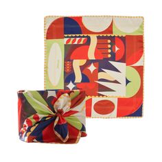 two square plates with colorful designs and a bow on the front one plate has an abstract design