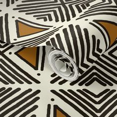 an abstract design with gold and black stripes on a white wallpapered room floor