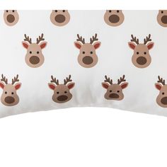 a white pillow with reindeer faces on it