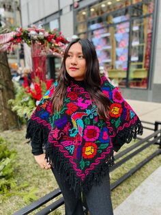 These beautiful Mexican ponchos (aka mañanitas) are handmade in Hueyapan Puebla. Every poncho bears unique hand-embroidery according to the traditions of the community. Measuring approximately 34" wide by 26'' long, one size should fit all adults. All ponchos can be worn 2 ways: Flat across the front or point down, for a longer, more flowing look. (Each piece may slightly vary from the model in the photo) Traditional Fringe Poncho One Size, Winter Festival Embroidered Poncho, Traditional Embroidered Winter Poncho, Traditional Embroidered Poncho For Winter, One Size Embroidered Poncho For Fall, Bohemian Embroidered Festival Poncho, Embroidered One-size Poncho For Fall, Embroidered One Size Poncho For Fall, Embroidered Poncho For Fall, One Size