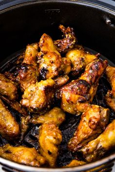 chicken wings are cooked in an air fryer and ready to be served on the grill