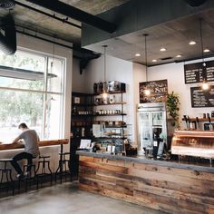 the inside of a coffee shop with lots of counter space