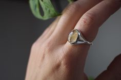 Unique signet ring with yellow citrine. Material: sterling silver Size:54 Gemstone: citrine If you want to see more signet rings, follow this link: https://www.etsy.com/shop/AtelierTiuh?ref=seller-platform-mcnav&section_id=32800820 For more rings, follow this link: https://www.etsy.com/shop/AtelierTiuh?ref=seller-platform-mcnav&section_id=27809423 Minimalist Sterling Silver Signet Ring With Gemstone, Citrine Gemstone Signet Ring, Sterling Silver Oval Cabochon Signet Ring With Polished Finish, Sterling Silver Signet Ring With Polished Oval Cabochon, Sterling Silver Gemstone Signet Ring Fine Jewelry, Sterling Silver Signet Ring With Bezel Setting As Gift, Silver Tourmaline Ring With Polished Finish, Polished Tourmaline Ring As Gift, Polished Tourmaline Rings For Gift