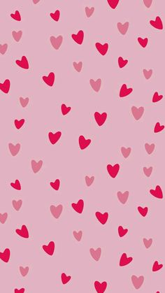 a pink background with lots of hearts on it