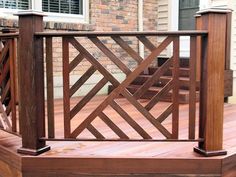 a wooden deck with railings and steps