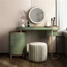 a dressing table with a mirror, stool and round mirror on it's side