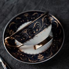 a cup and saucer sitting on top of a plate next to a fork,