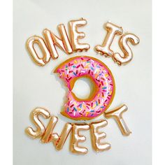 one is sweet and two are donuts with sprinkles