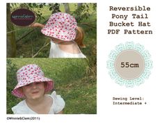 a girl wearing a pink hat with flowers on it and the words reversible pony tail bucket hat pattern