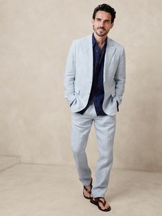 This European linen suit pant traverses all seasons thanks to its natural breathability and beautiful finish—seen here in a rich délavé blue.  Tailored Slim Fit: Mid-rise.  Tapered slim leg.  Zip fly with button-tab waistband.  Belt loops and after-dinner split detail at back.  Front and back pockets.  Half lined (lined to the knee).  Tailored Slim Fit: Mid-rise.  Tapered slim leg.  Inseams: Short 29. 5", Regular 31. 5", Long 33. 5" Model: Size 32 Regular, 6'2" (188cm). Linen Pants Suit, Suit Pant, Linen Suit, European Linens, Slim Leg, Slim Legs, Wedding Guest Outfit, Summer Sale, First Look