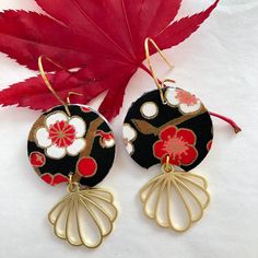 "About the earrings: These art deco earrings are made with a luscious, black, red and white chiyogami paper. This Japanese paper is hand-printed using the silk-screen technique. In this laborious process each color is applied using a separate screen. Sometimes as many as 12 colors, including gold or other metallics, may be used to create a single pattern. Often inspired by textile and kimono patterns which include symbolic and seasonal motifs, designers of chiyogami continue to expand the options. In these paper earrings, the cherry blossoms are a symbol for the fleeting nature of life. The brass component adds a \"art deco\" look that I love in these elegant looking paper earrings. Since these earrings are hand made, each set of earrings is different and unique! While they'll be made from Black Retro Handmade Jewelry, Retro Black Handmade Jewelry, Vintage Black Enamel Earrings For Gifts, Unique Handmade Black Earrings, Black Retro Earrings, Black Enamel Dangle Earrings For Gift, Vintage Black Drop Earrings, Gift Black Enamel Dangle Earrings, Black Dangle Flower Earrings With Ear Wire