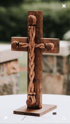 a wooden cross sitting on top of a table