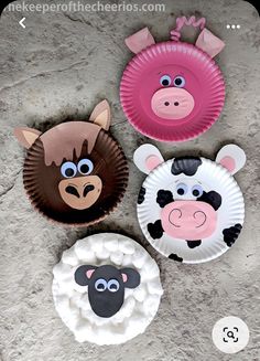 three paper plates with farm animals on them, one is pink and the other is brown