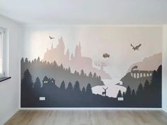 an empty room with a large mural on the wall