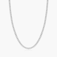 14K White Gold Straight Diamond Tennis Necklace (7.00 CTW - H-I / SI1-SI2). This tennis necklace is the epitome of elegance. A row of sinctillating round brilliant diamonds are set on four prong baskets and lined up perfeclty to create the most glamorous diamond necklace. A box clasp with security latch closes and secure the necklace in place. Diamond Tennis Necklace, Box Clasp, Tennis Necklace, Fine Jewellery Necklace, Brilliant Diamond, Lab Created Diamonds, A Box, Round Brilliant, Diamond Shapes