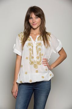 3702 W/Gold Light, airy, soft comfortable blouse in superior cotton with hand embroidery. Different patterns of embroidery all over the front with elastic endings makes it versatile for all body type. Short sleeves with button accent. Get that smart look over jeans, a must-have versatile top.  Overview:  Material: 100% soft superior cotton  CARE: -Easy care machine washable  Machine wash cold with light color in a gentle cycle  Tumble dry low Remove promptly Steam iron or warm iron as needed *Quality merchandise shipped from the USA Hand Embroidered Tunics, Comfortable Blouses, Embroidered Tunic Top, Blue Dye, Steam Iron, Embroidered Tunic, Gold Light, Embroidered Top, Different Patterns