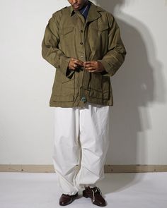 100% cotton Made in France Size A 21" B 25" C 28.5" D 28" Male model is 175cm / 5'7" Spring Cotton Parka, Cotton Parka For Workwear In Fall, Spring Khaki Cotton Parka, Cotton Outerwear With Cargo Pockets And Long Sleeves, Khaki Cotton Utility Jacket With Side Pockets, Cotton Outerwear With Cargo Pockets, Khaki Cotton Parka For Fall, Fall Khaki Cotton Parka, Military Style Cotton Sport Coat For Winter