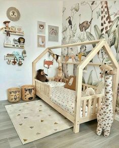 a child's bedroom with a wooden bed and animal themed wallpaper on the walls