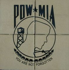 a sign on the side of a building that says pow mia you are not forgotten