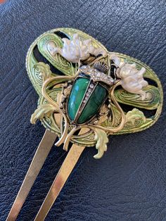 Scarab beetle and Lotus Flower Decorative Hair comb Gorgeous Art Nouveau style barrette with lotus flowers, gorgeous resin, crystals and bronze vintage components. Unique, large scroll gorgeous hair ornament. Large piece of about 3 inches by 4-1/2 inches. Hand painted and sealed. Hand crafted for the sophisticate in mind. by Myelegantthings USA Art Deco Inspired Jewelry, Futuristic Jewelry, Antique Hair Combs, Decorative Hair Combs, Bijoux Art Nouveau, Vintage Hair Combs, Scarab Beetle, Hair Adornments, Egyptian Revival