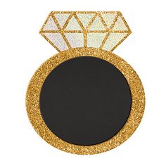 a black and gold plate with a diamond in the center on it's side