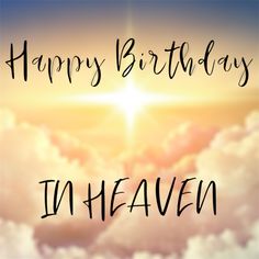 the words happy birthday in heaven are written on top of clouds with a cross above them