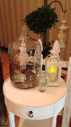 a white table topped with a glass jar filled with money