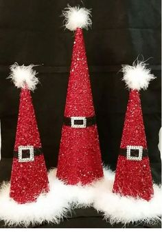 three red glitter santa hats with white fur on the bottom and one wearing a santa claus hat