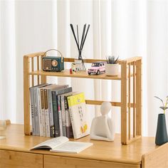 a wooden shelf with books and other items on it