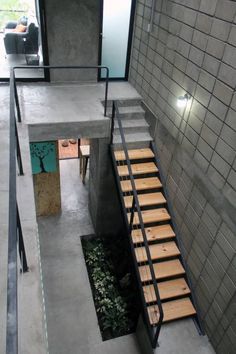 stairs leading up to the upper level of a building with stone walls and flooring