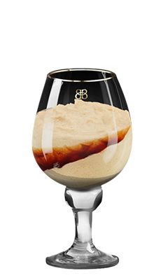 an empty wine glass filled with liquid and sand