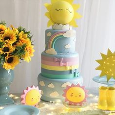 there is a cake with sunflowers on it and other decorations around the cake