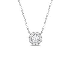 That one piece that will inject a shot of glamour into your looks. This white gold necklace features round diamond surrounded by a halo of smaller round diamonds. Four prongs secure the center diamond in place. The timeless look of this necklace allows you to pair it with almost any of your favorite outfits.