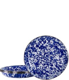 two blue and white plates sitting next to each other