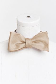 Hey babes! Does your boo need a new bow tie for your bestie's big day!? Well we have found the perfect accessory for him! Mumu (mens) weddings is finally here! The Josh Bow Tie is the OG formal look that does no man wrong! He is the life of the party and the best date in town! Whether he's a guest or a groomsmen, now you both can be in Mu when your watching an "I do!This color was created to compliment our Champagne dresses, due to the varying fabrics, there may be slight shading discrepancies Adjustable Butterfly Knot Bow For Wedding, Classic Adjustable Bow For Groom, Classic Wedding Bow Tie With Bow Tie Back, Adjustable Bow For Groom, Dapper Adjustable Bow Tie For Weddings, Classic Gold Bow Tie For Groom, Dapper Bow For Groom, Adjustable Dapper Bow For Wedding, Classic Detachable Bow Tie For Groom