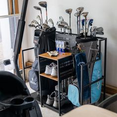 a rack with golf clubs and bags on it