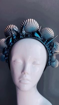 Yet another attempt at capturing the beauty of the ocean with our mermaid crown, crafted from an exquisite selection of seashells and inspired by the wonder of the sea. Handcrafted in deep ocean blues and shimmering black highlights, this seashell headband is for any sea-loving mermaid looking to add a touch of mystical magic to their look. 



Color - Deep Blue hues and black shimmer highlights


Age Group/Gender - 
Fits ages 10 and up & Adults Unisex

Material - Headband with sea shells and pa Sea Witch Crown, Handmade Blue Shell, Blue Ocean-inspired Shell For Summer, Blue Bohemian Shell For Summer, Bohemian Blue Shell For Summer, Material Headband, Witch Crown, Seashell Headband, Mermaid Headpiece