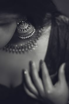 black and white photograph of a woman's back with jewelry on her neck