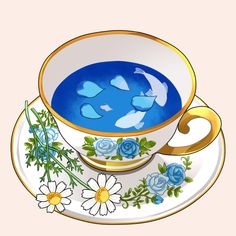 a tea cup with fish in it and daisies on the saucer next to it