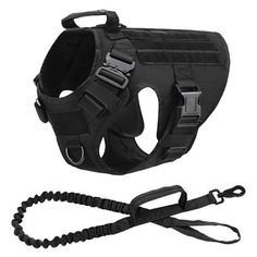 a black dog harness and leash on a white background