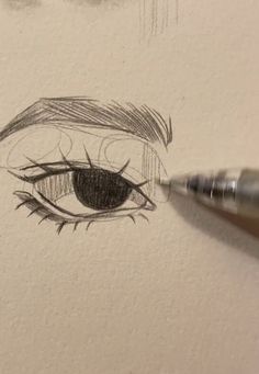 a drawing of an eye with a pencil in it's left hand and the bottom part of the eye is drawn